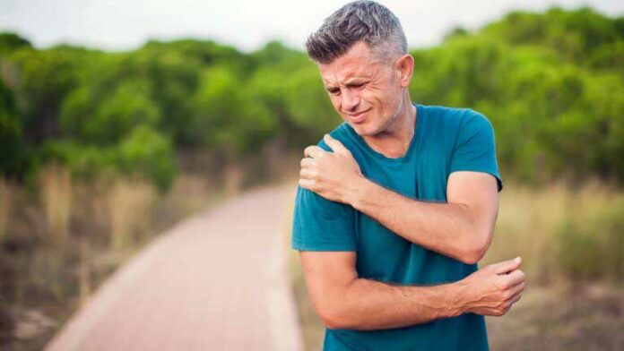 Shoulder,Pain.,Man,With,Arm,Injury,Outdoor.,Healthcare,And,Medicine